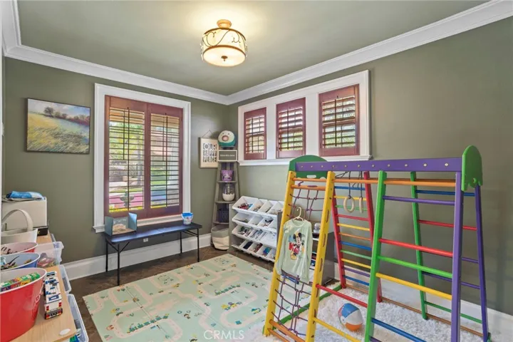Versatile flex room offers space for a home office, playroom, study, or hobby room