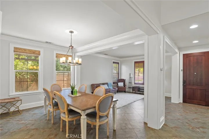Large windows fill the dining area with natural light