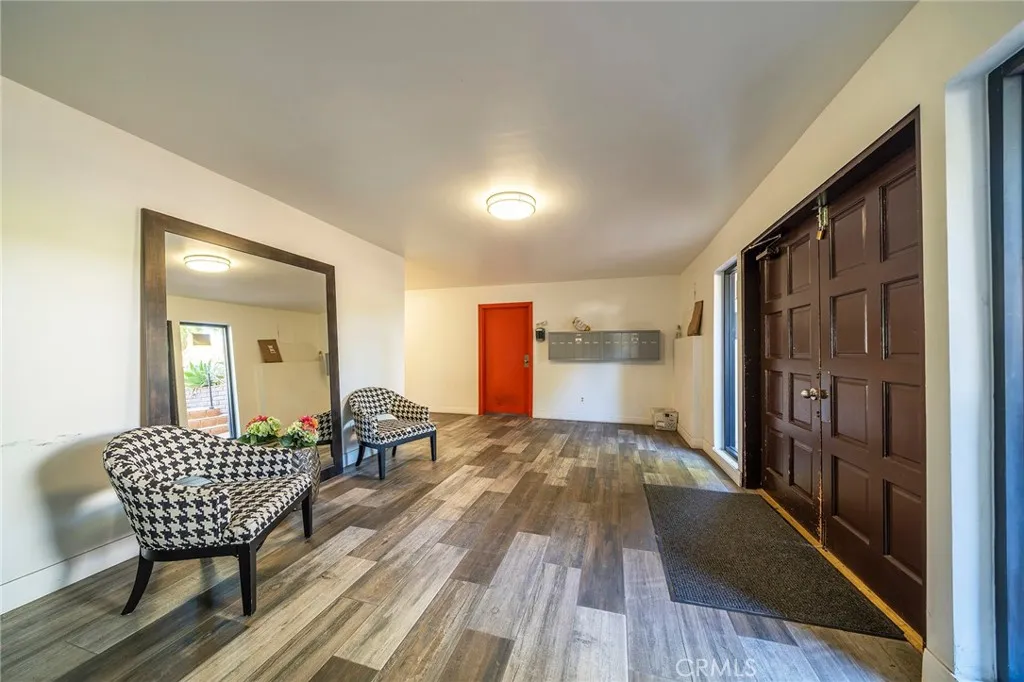 Lobby entrance to bike storage, private lockers for each condo, elevator, Hoa meeting room, entrance to the parking garage and community laundry