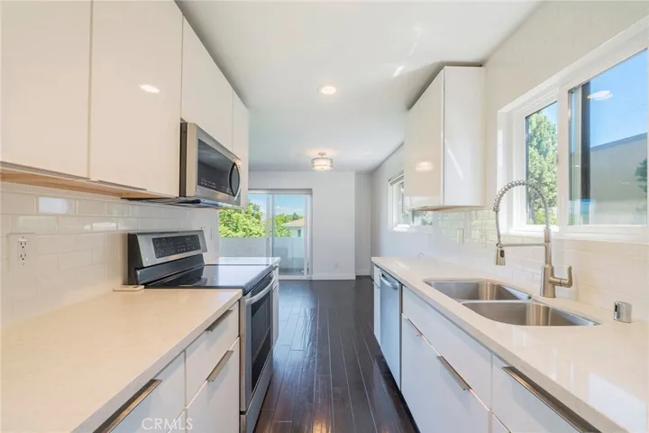 Kitchen view to dining and balcony