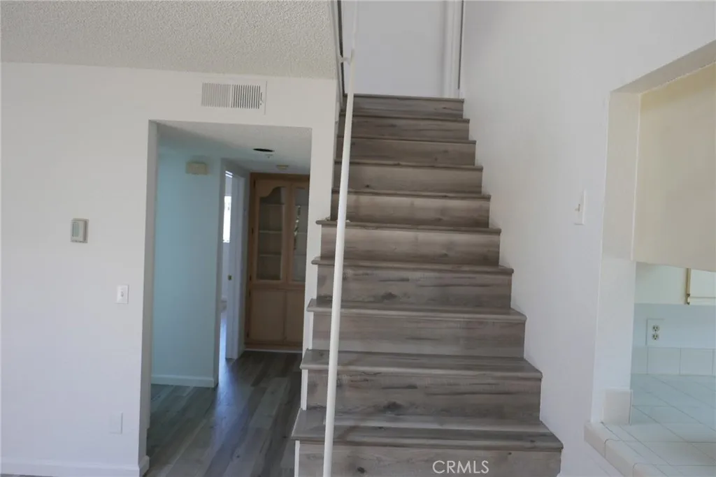 Steps to usstairs bedroom and bath, plus bonus room