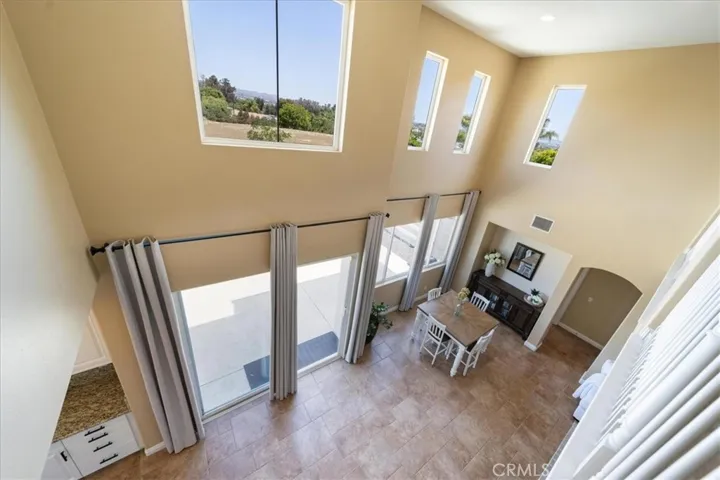 View from upstairs loft to downstairs kitchen and eating area.
