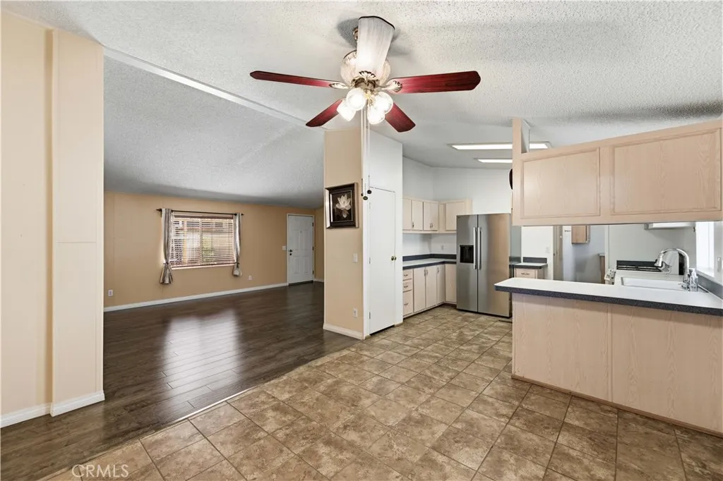 Dining area facing living room and kitchen