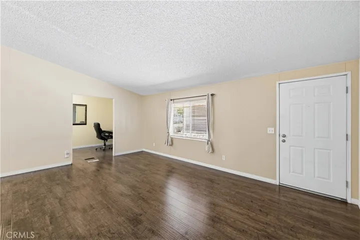 Living room facing bonus room/office