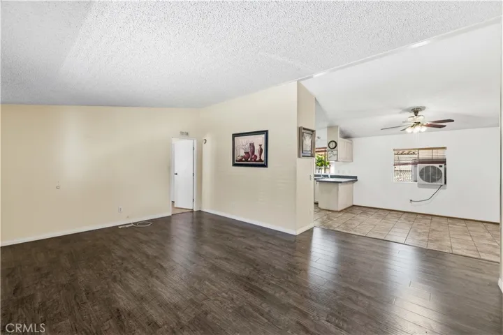Living room facing kitchen and dining area.