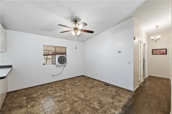 Dining area leading to guest rooms and hall bathroom.