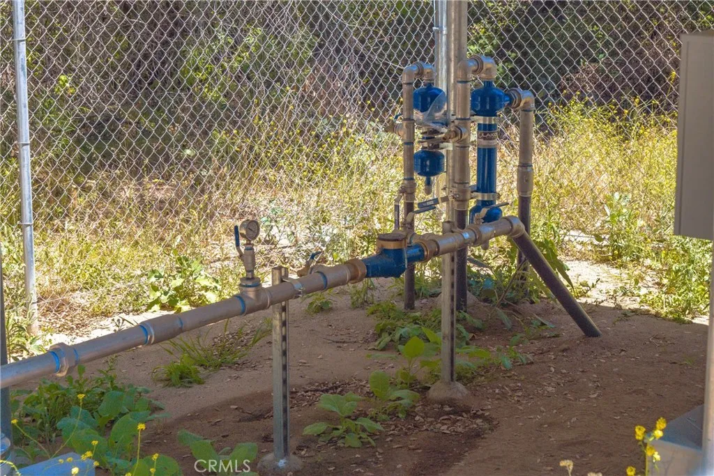 New well piping and enclosed for security.