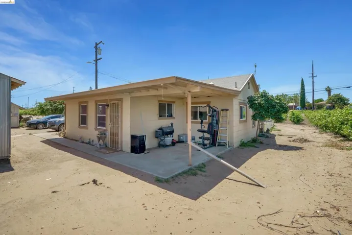 Rear exterior featuring a covered patio