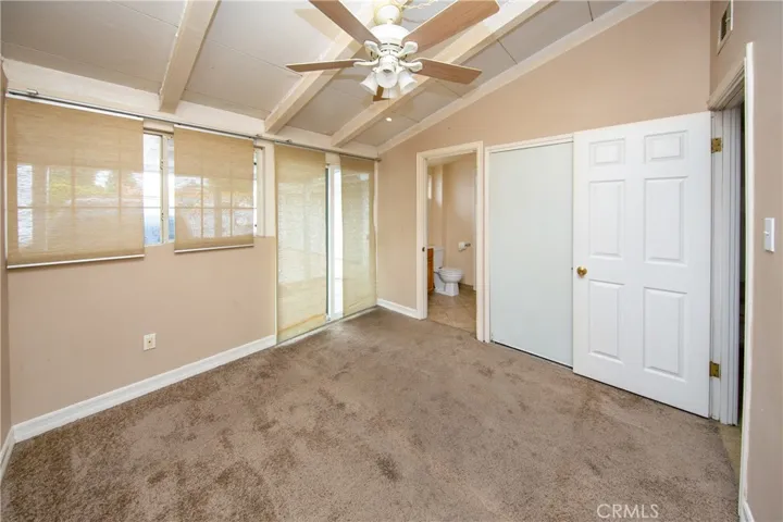 Southeast Bedroom with sliding glass door to front porch