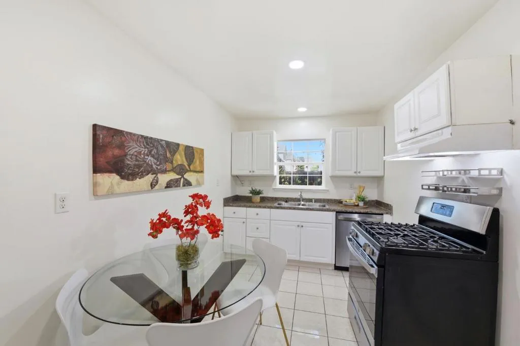 Back unit Tile floors and white kitchen