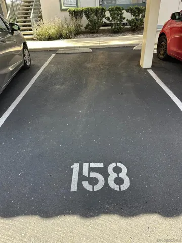 Assigned parking space # 158 is underneath a carport.