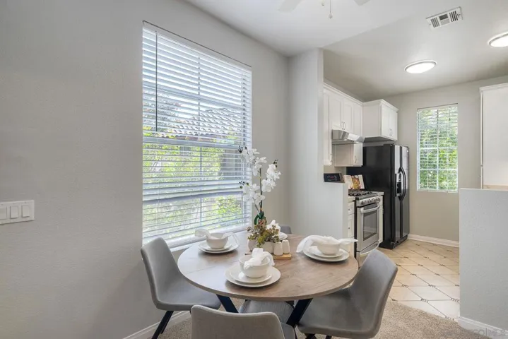 Adjoining the kitchen is a delightful dining area.