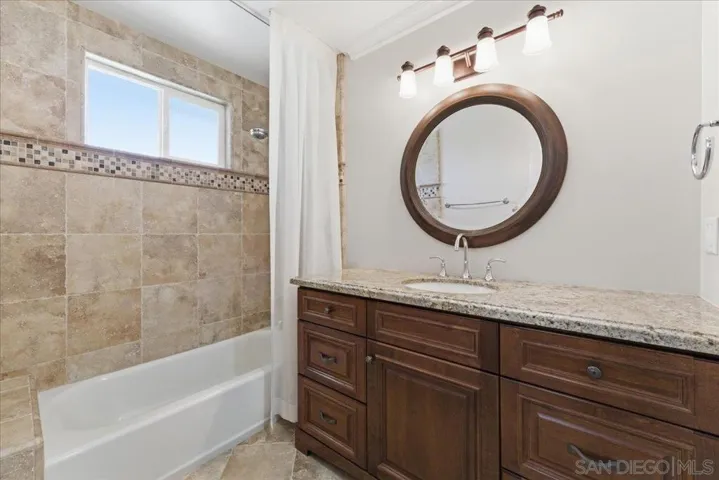Ensuite bathroom with tub/shower combo. Separate toilet area.