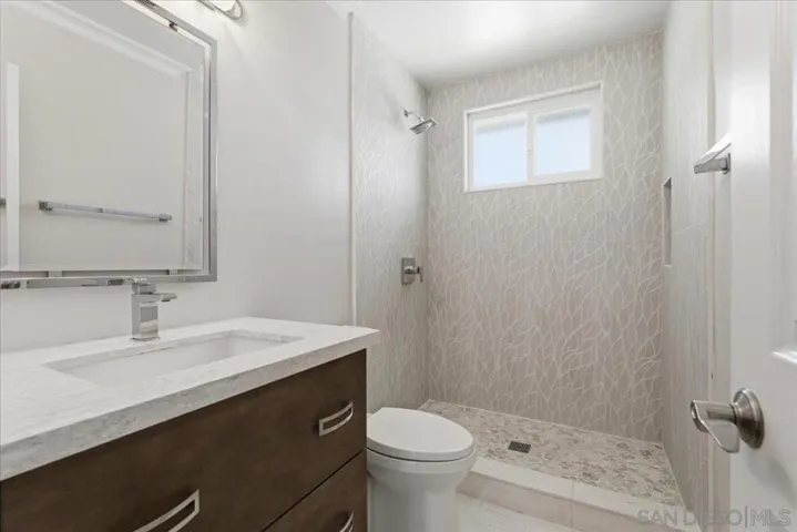Guest bathroom with walk in shower.