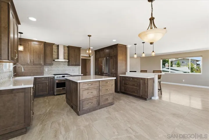 Open concept kitchen and dining room. Slider is just outside the dining room table. Enjoy the view while you're dining.
