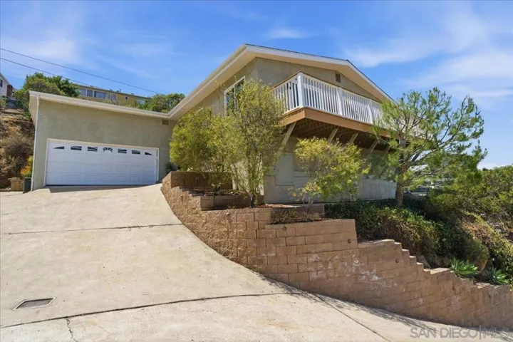 Located high on the hill with sweeping views of the mountain range and city below.