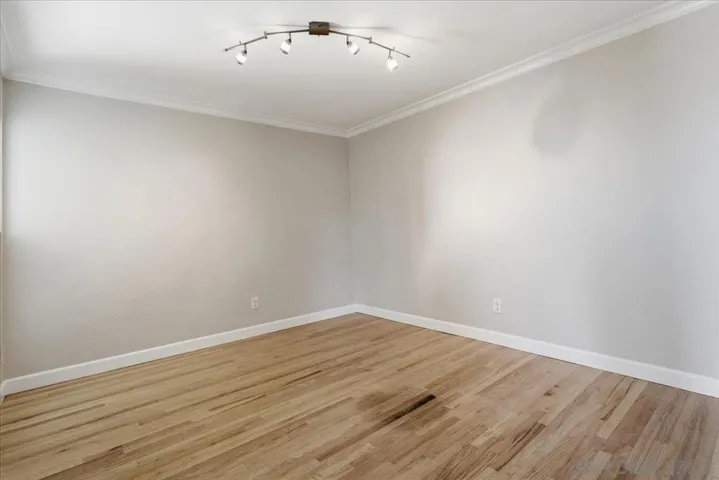 Was used as an office. Double doors lead to a nice sized bedroom with TV mount and ceiling light.