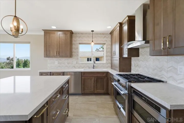 Custom kitchen with gas cooking and tons of storage.