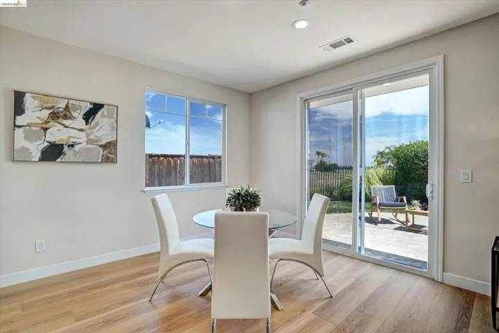 Bright interior space featuring wood-finish flooring, recessed lighting, and a large window