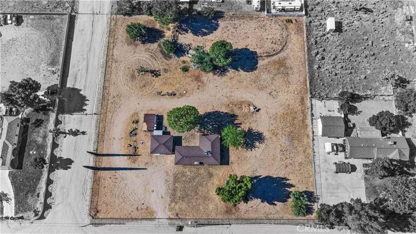 Ranch Home, Converted Garage, and fenced riding arena in the back.