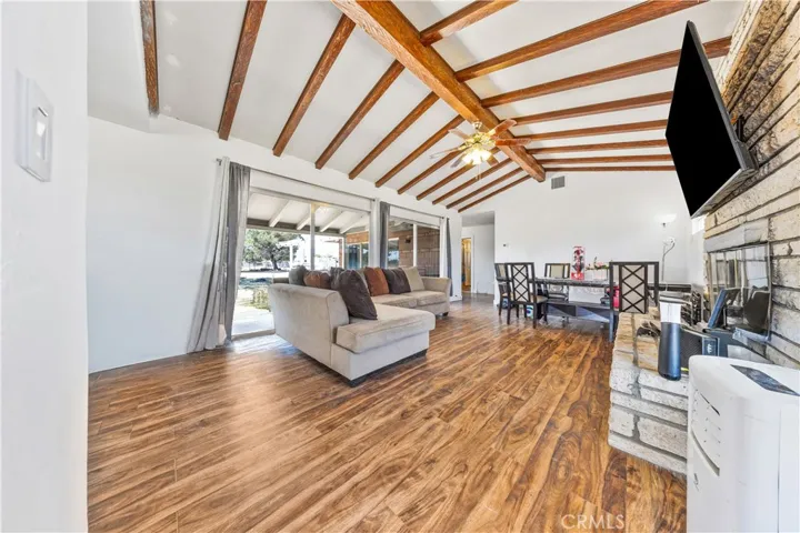 Vaulted expose beam ceilings, bright open concept, bright space and direct access to outdoor.
