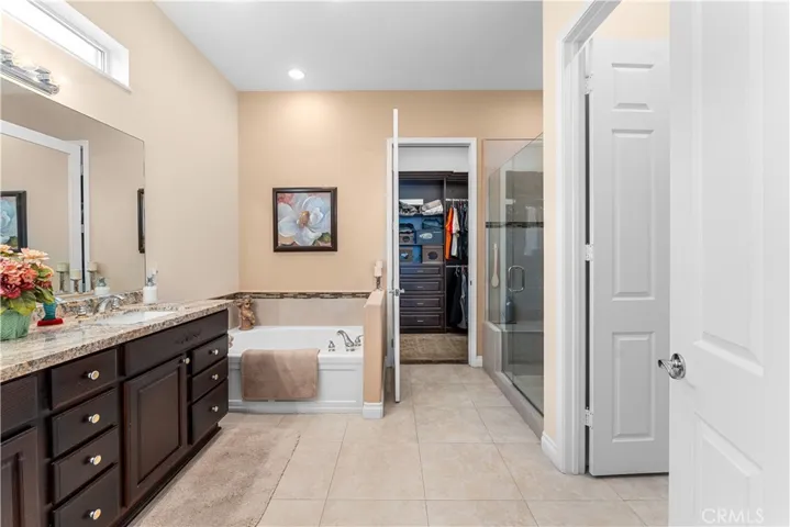 Privacy Door to Commode and Door leading to Huge Custom Organized Closet in Primary Bath