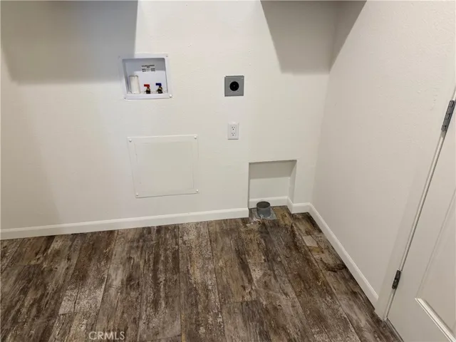 Below cabinets in laundry room