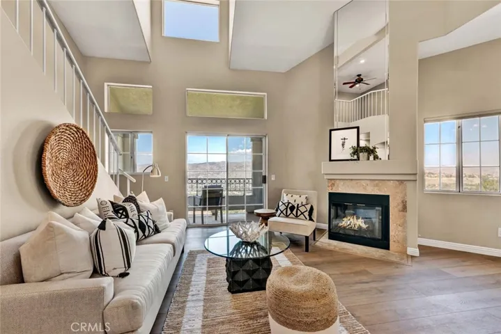 Cathedral ceilings, luxury vinyl flooring, panoramic views from every window, and a cozy fireplace.