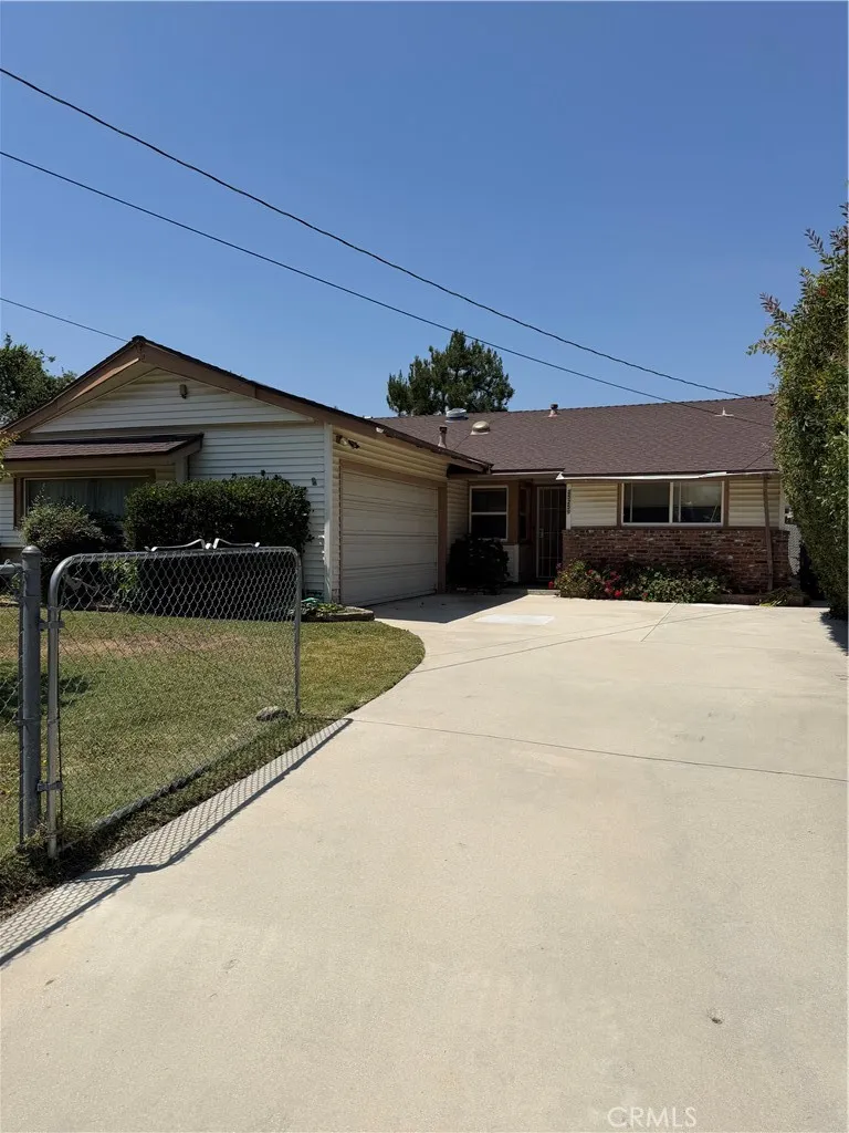 Front of home with attached garage.