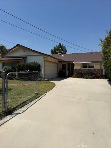 Front of home with attached garage.