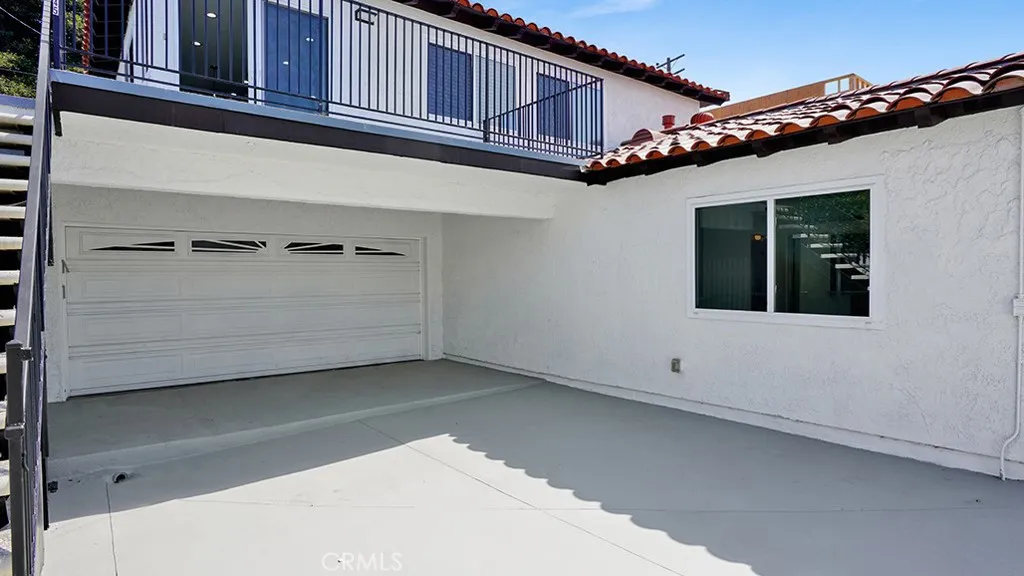 This garage has dual entry doors. One from the driveway and one from the alley.