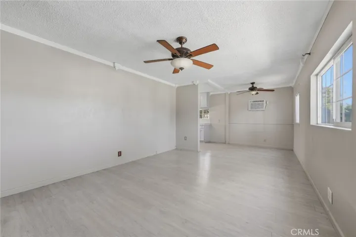 Welcoming entry opens to a sun-filled living room with incredible natural light.