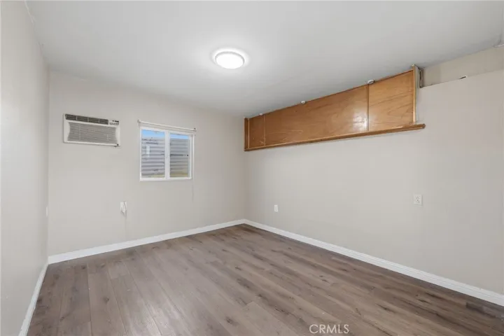 Garage-converted living area offering a flexible bonus space ideal for lounging, entertaining, or extended living.