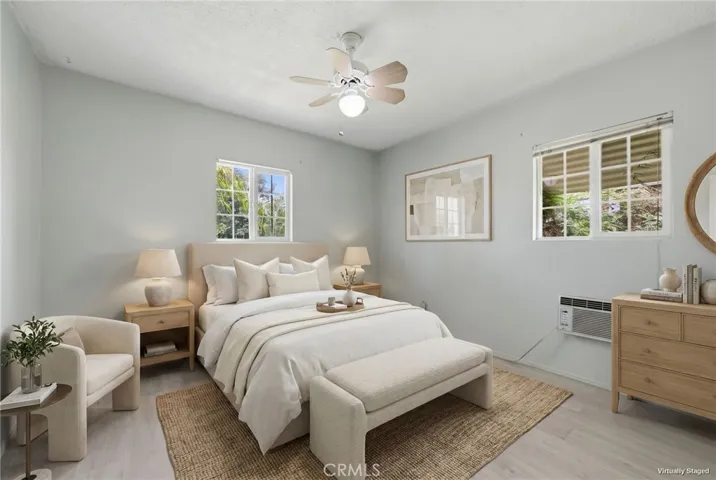 Virtually staged secondary bedroom showcasing its versatility as a comfortable guest room or office.