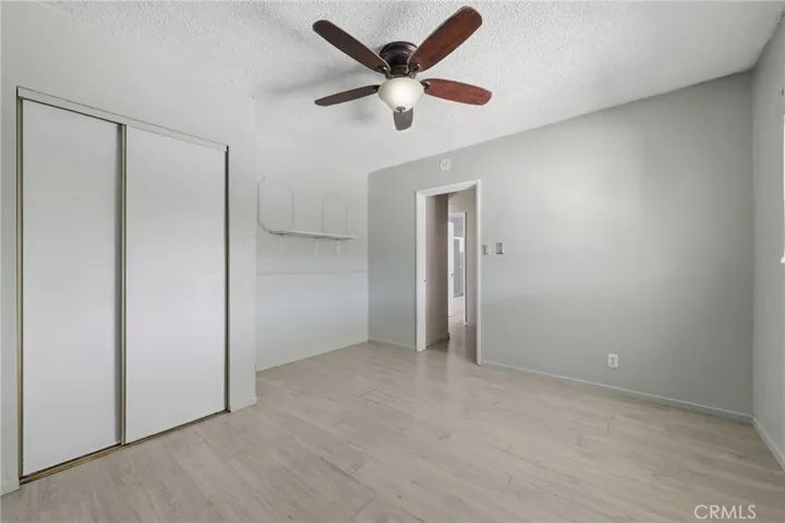 Bedroom 2 offering versatile use with convenient access from both the hallway and kitchen, ideal for guests, office, or flex space.