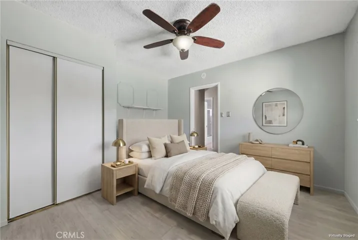 Virtually staged Bedroom 2 showcasing its versatile use with convenient access from both the hallway and kitchen, ideal for guests, office, or flex space.