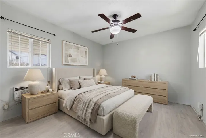 Virtually staged primary suite showcasing a spacious, light-filled private retreat.