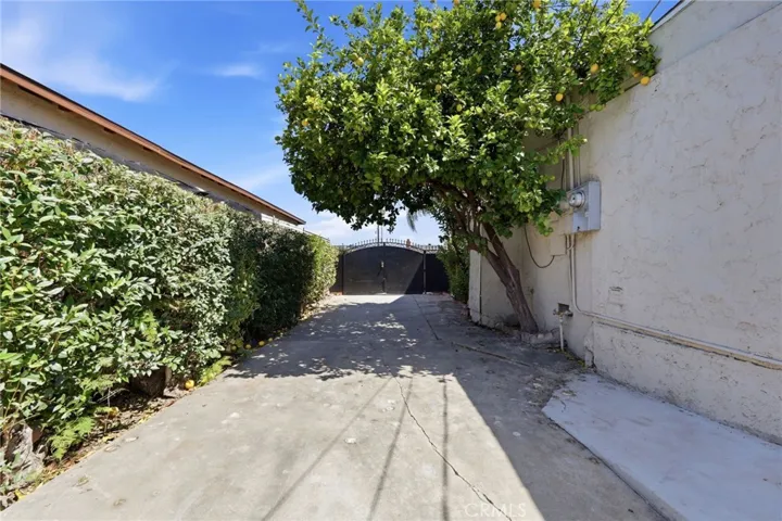 Long driveway with gated entry offering added privacy, security, and ample off-street parking.
