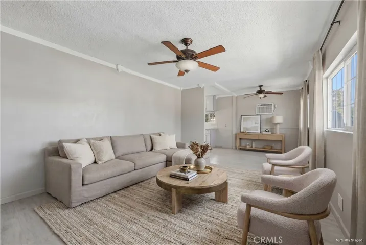 Virtually staged living room showcasing the home’s bright, open layout.