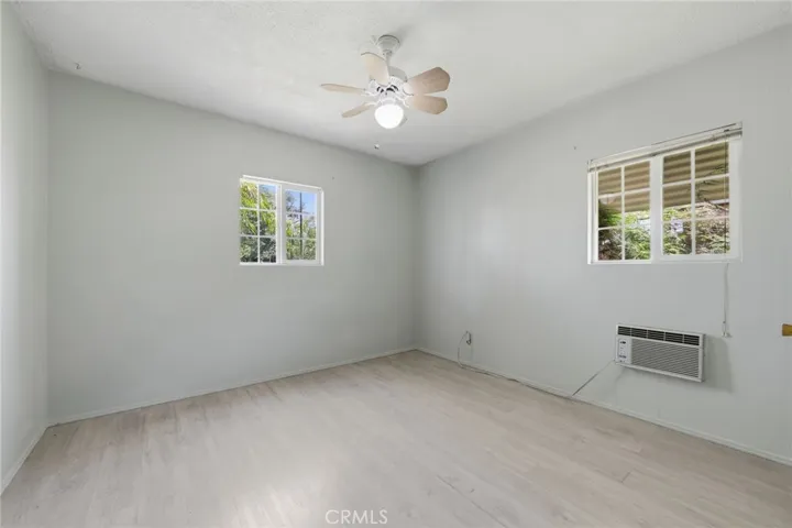 Secondary bedroom offering flexible space for guests, work, or everyday use.