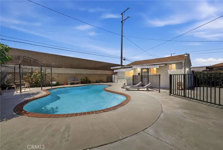Inviting pool setting with ample space for lounging and enjoying the backyard lifestyle.