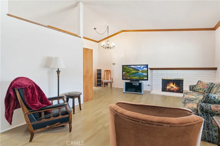 Virtually staged with vinyl plank flooring- seller willing to give a credit for new flooring.