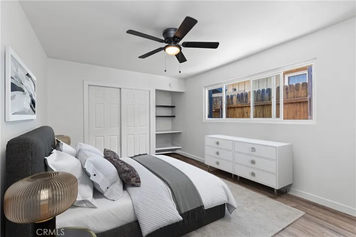 Large third bedroom with new flooring and closet.  Digitally enhanced photo.