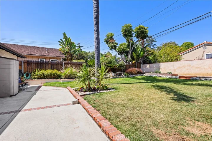 Large grassy backyard with back patio for entertaining and enjoying the great weather.