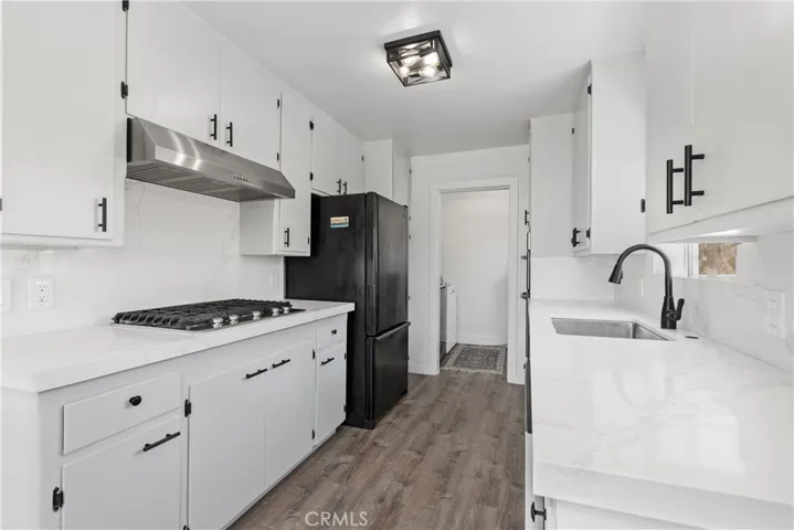 Remodeled kitchen with new appliances and hardware.