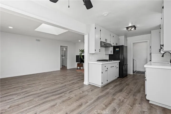 Dining area looking towards living area and remodeled kitchen.