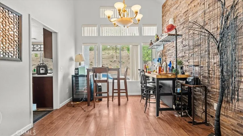 Wood Flooring and Brick accent wall.