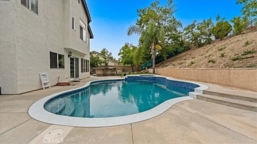 Backyard has a hill where you can actually turn into additional enjoyment area.