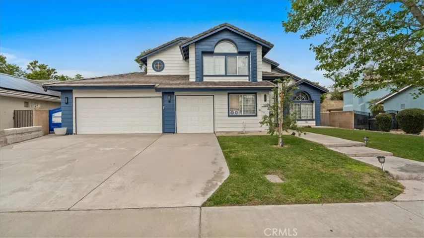 Front of House, 3 car garage and RV Gate