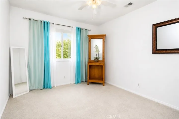 This image has been digitally enhanced to illiterate how the look and feel of the bedroom  can change with a new paint and flooring.